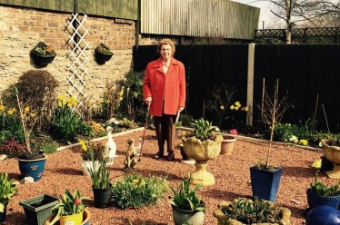 Mary Smith in her garden