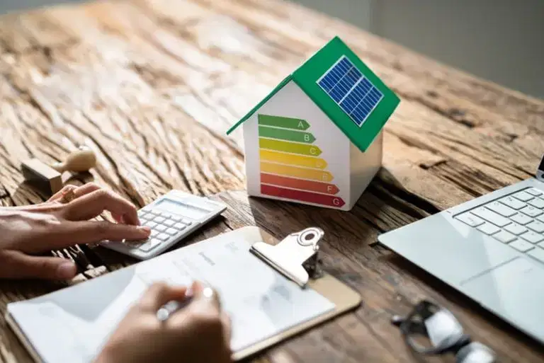 energy rating showing on a house on a desk with notepad