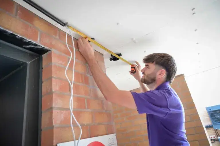 Star employee with measuring tape on ceiling