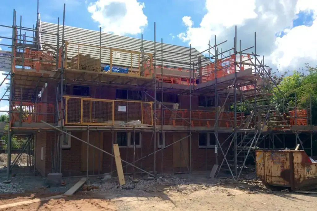 home in the middle of construction with scaffolding