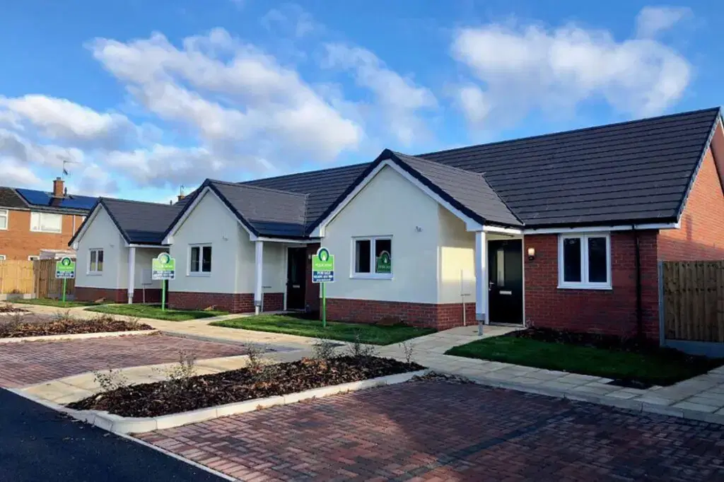 new build homes front view with for sale signs