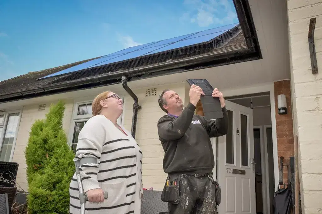 Star employee showing a customer a roof