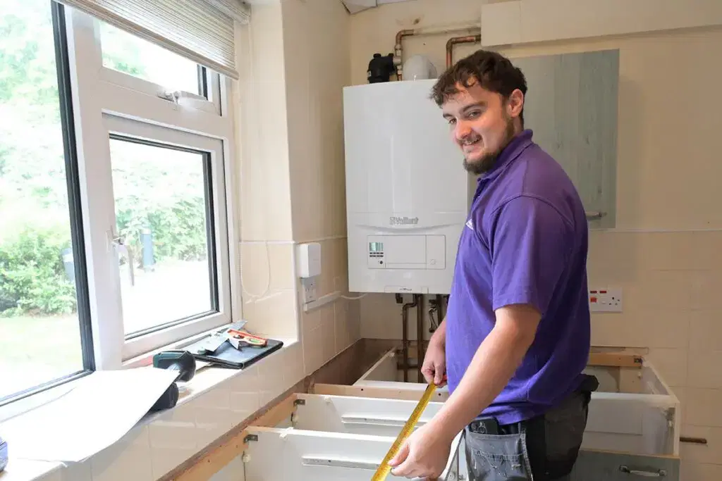 Star employee working on a repair inside a home