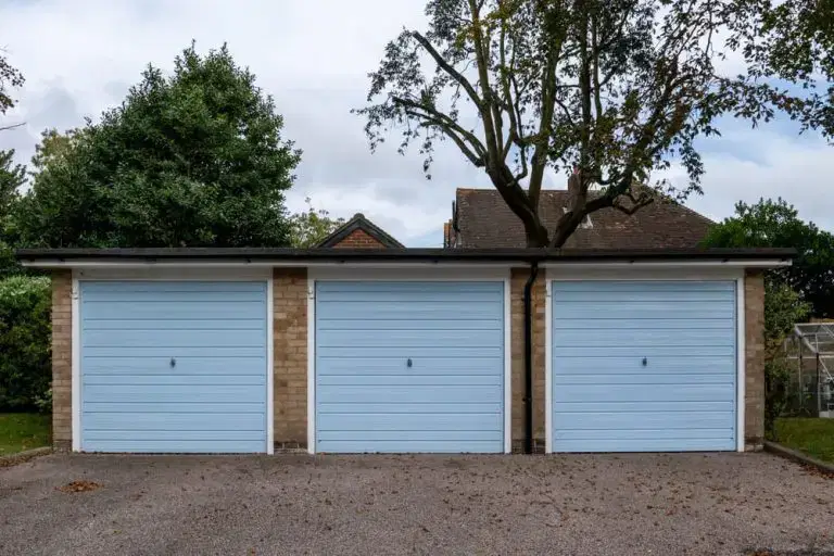 row of 3 blue garages