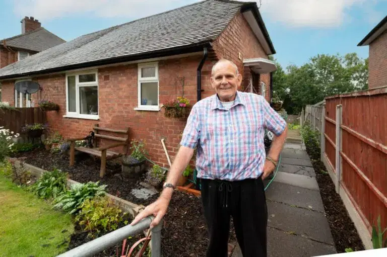 customer Peter in front of home