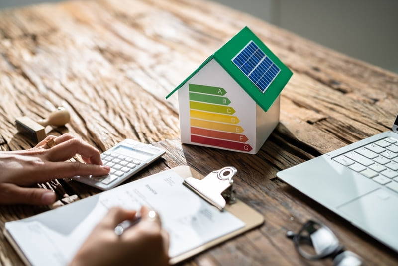 energy rating showing on a house on a desk with notepad