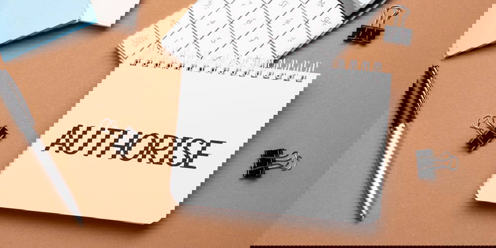 the words Authorise written on a notepad