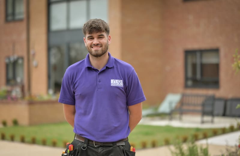 Max Electrician in front of house