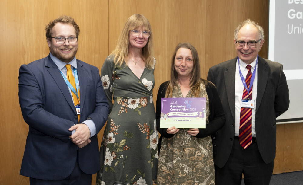 STAR Housing Garden Competition winner with certificate and staff