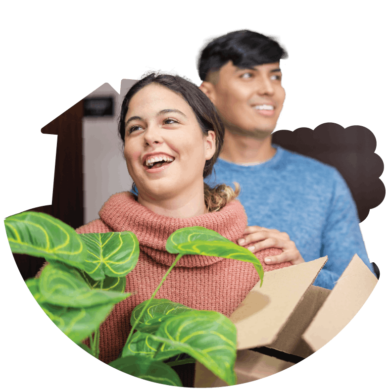 Man and woman moving into a home happy and smiling