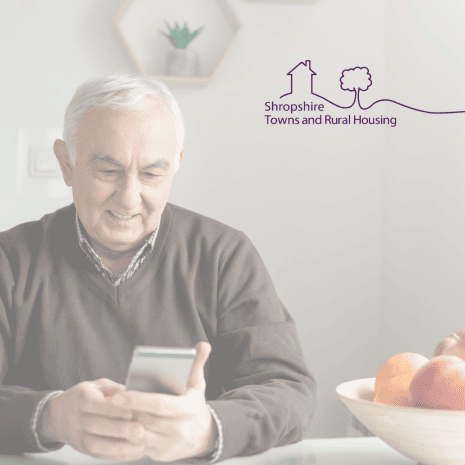 older man with phone and star logo